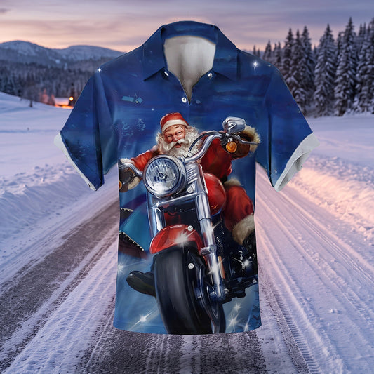 The Hells Elves Biker Santa Shirt, a blue Christmas shirt with Santa on a motorbike, on a snowy road at dusk